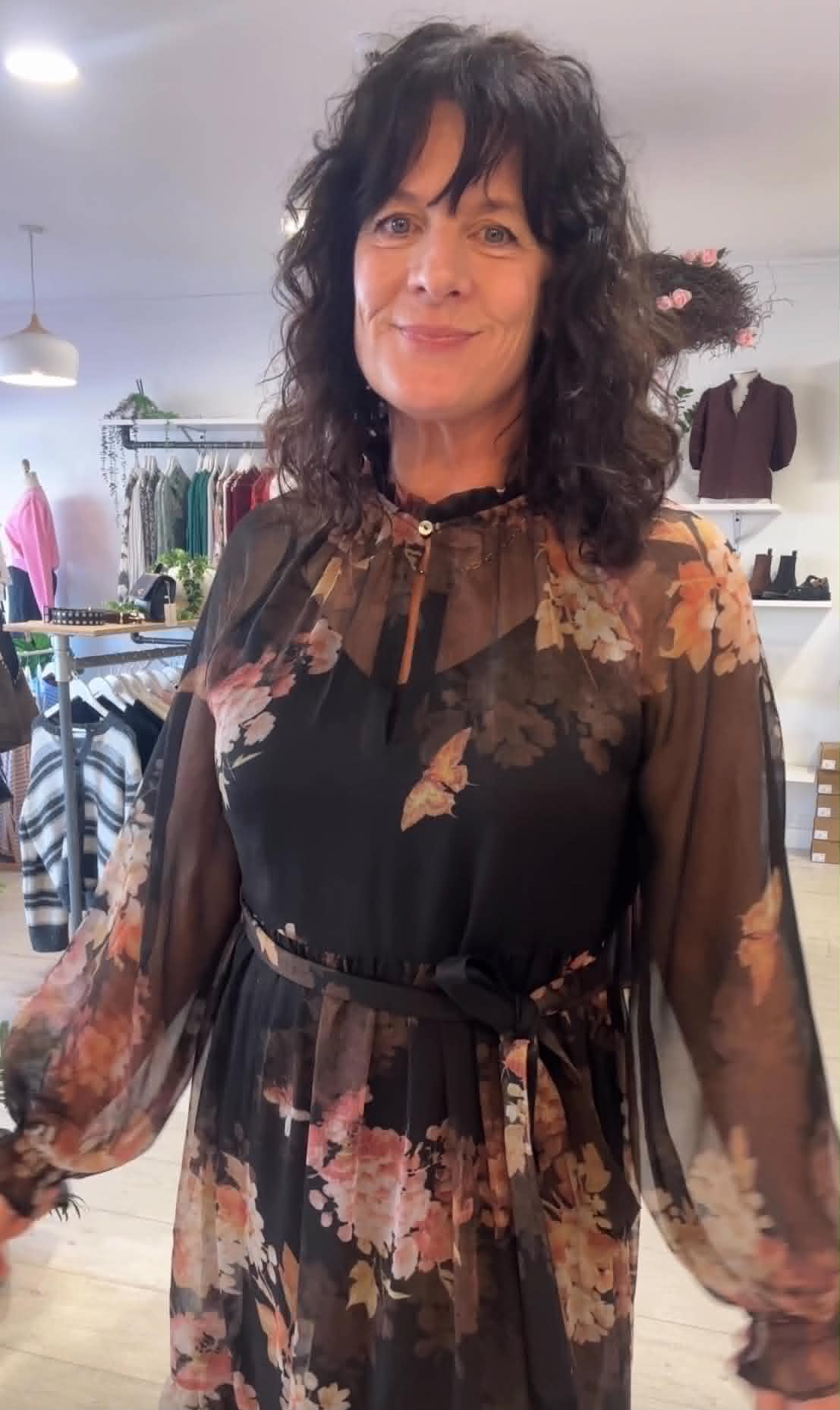 Ange wearing a floral dress at Absolutely Boutique NZ